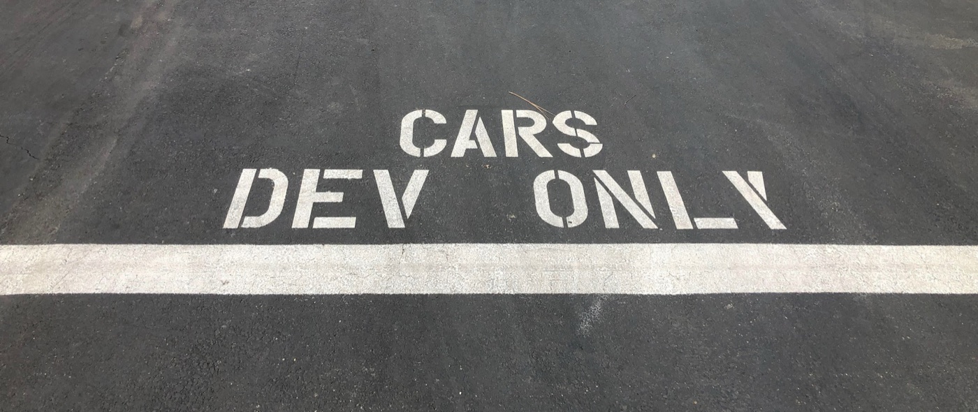Parking stall at the BMW Technology Office stenciled CARS DEV ONLY — the spot reserved for the development vehicles.