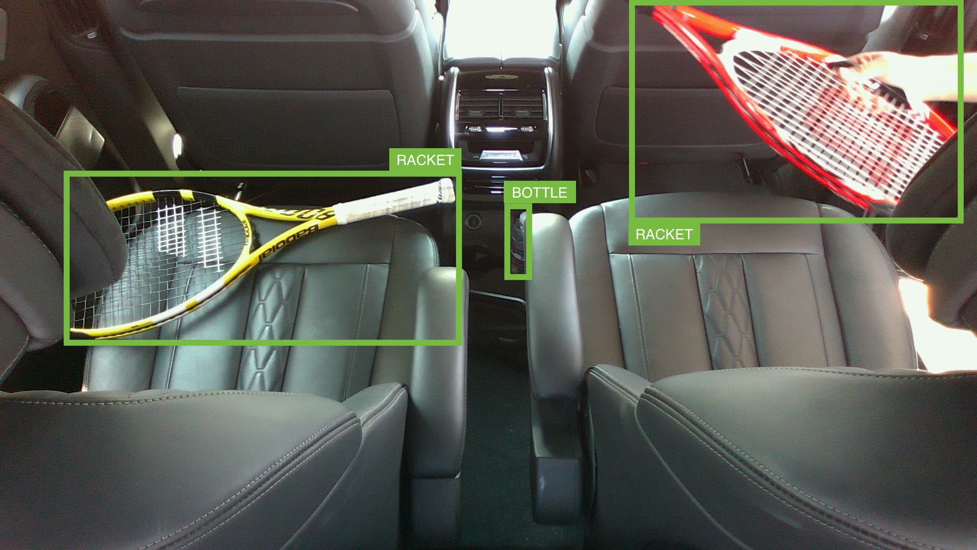 A reference image from the worker guide: rear-seat scene with multiple bounding boxes drawn around each object &mdash; racket, ball-tube, umbrella, helmet &mdash; including partially occluded ones.